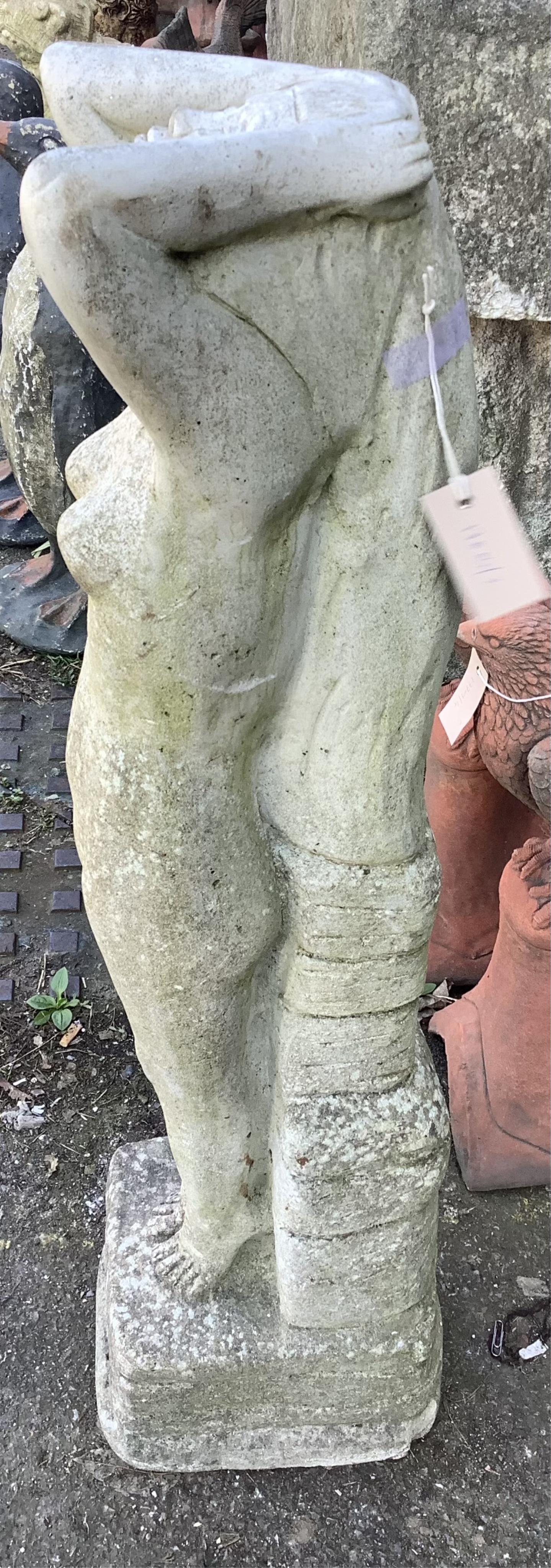 A reconstituted stone garden ornament, height 94cm